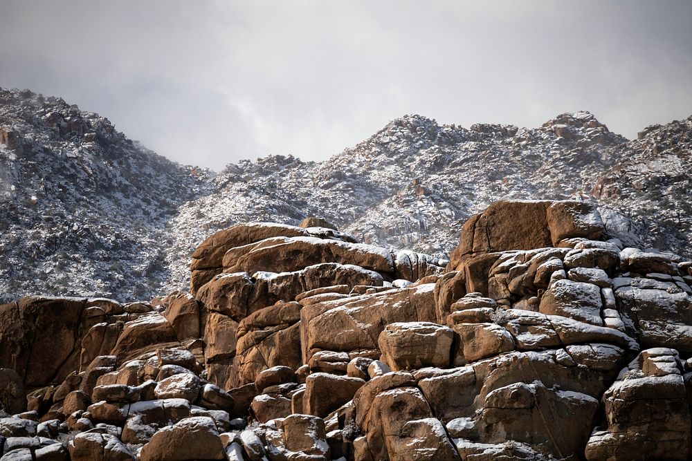 Dusting of snow on monzogranite boulders