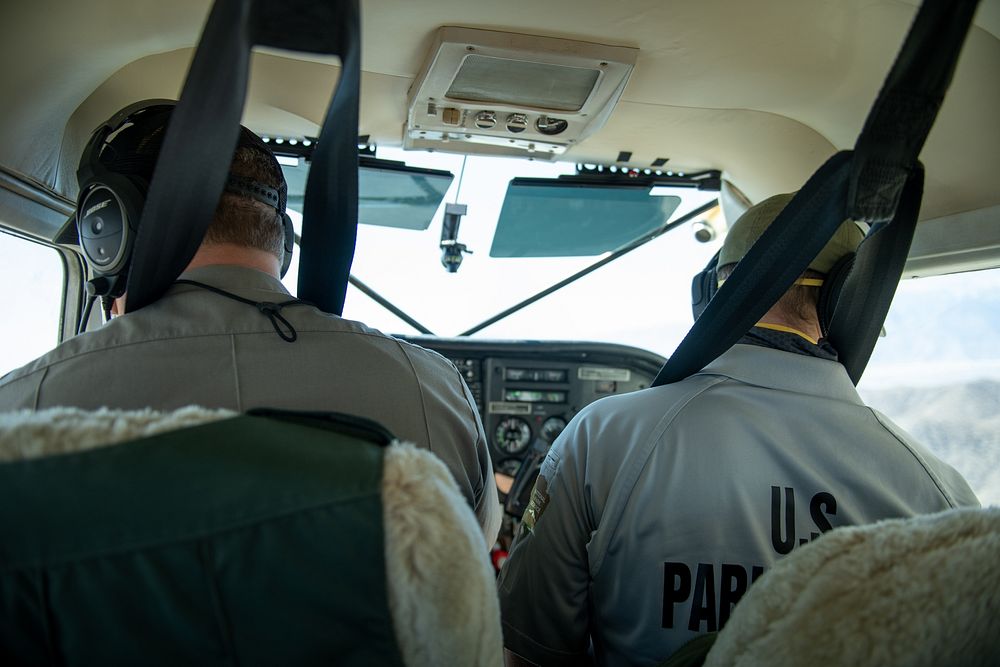 Park rangers inside NPS patrol plane