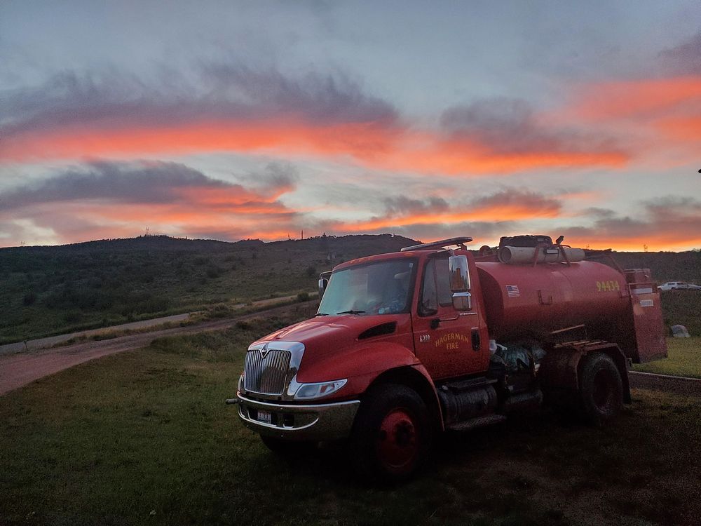 Muddy Slide Fire. Sunrise over a fire truck at the Muddy Slide Fire Command Post in Colorado. Photo by Routt National…