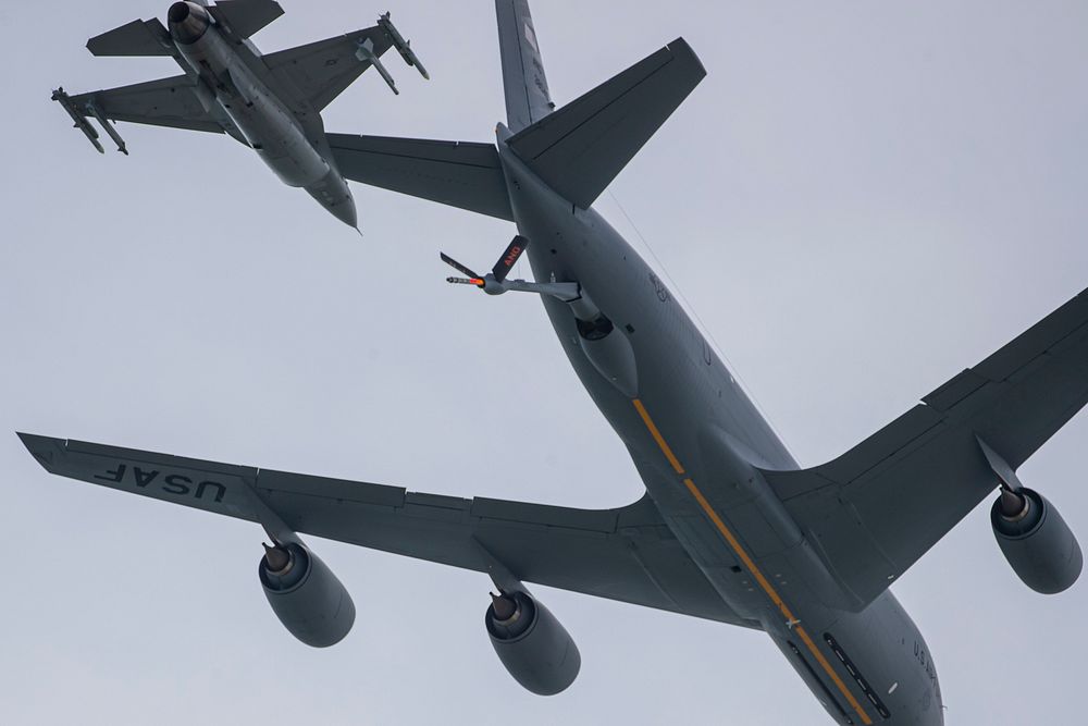 A New Jersey Air National Guard KC-135 Stratotanker with the 108th Wing flies along the beach flanked by F-16C Fighting…
