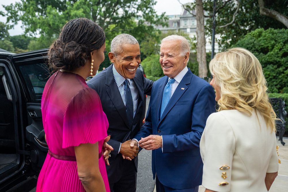 President Joe Biden and First Lady Jill Biden greet former President Barack Obama and former First Lady Michelle Obama…