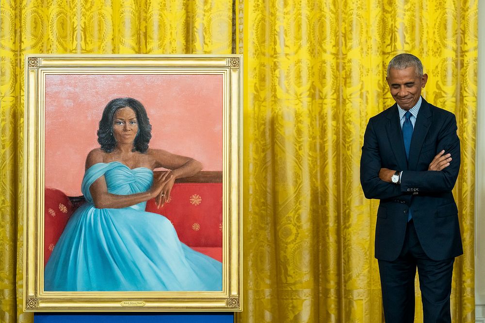 Former President Barack Obama stands by the portrait of former First Lady Michelle Obama the unveiling of their official…