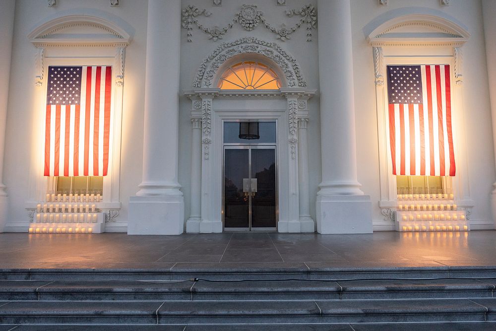Flags are draped on the North Portico of the White House, Sunday, September 11, 2022, to commemorate September 11, 2001.…