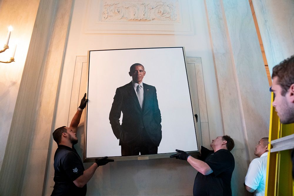 White House staff hang the newly-unveiled portrait of former President Barack Obama, Wednesday, September 7, 2022, in the…