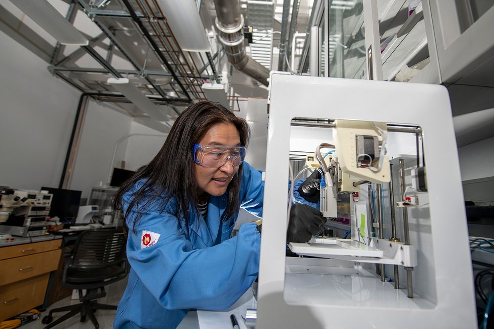 Ting Xu, Faculty Senior Scientist, Berkeley Lab, adjusts a 3D printer at Lawrence Berkeley National Laboratory. Xu has…