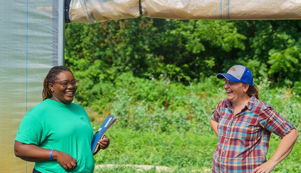 Amy Surburg, the owner of Berry Goods Farm in Morristown, Indiana, (right) talks with Sydney Lockett, district…
