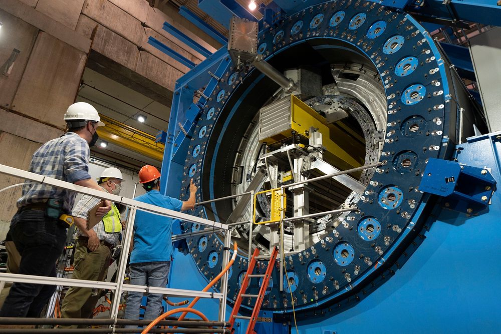 The sPHENIX detector under assembly. This image shows installation of the inner hadronic calorimeter within the core of the…