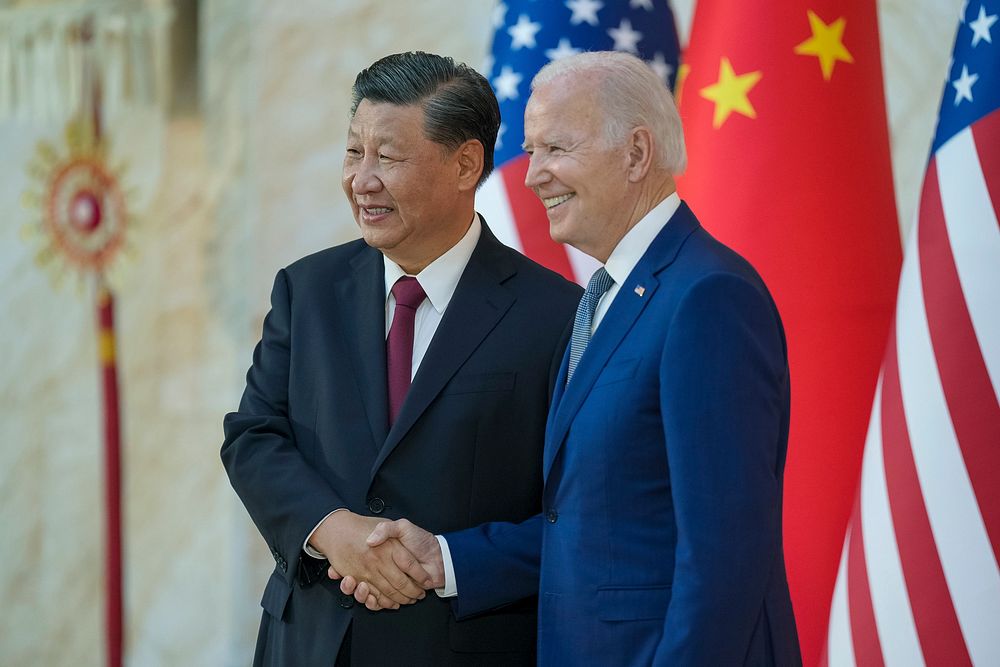 President Joe Biden greets and poses for a photo with Chinese President Xi Jingping ahead of their bilateral meeting…