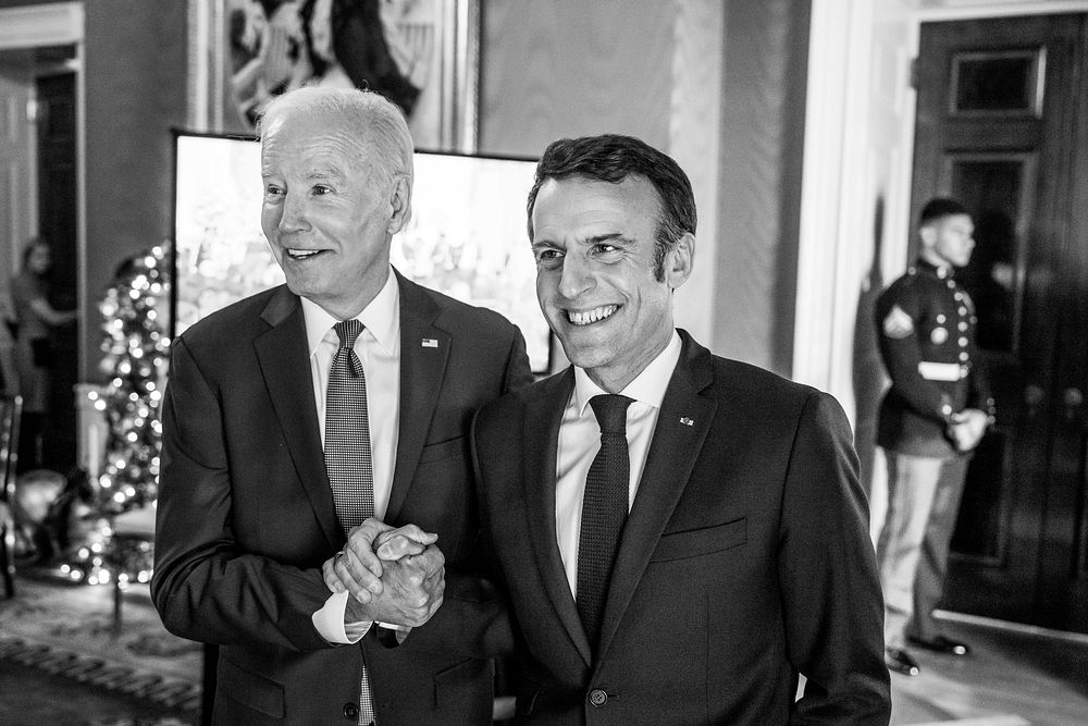 President Joe Biden and French President Emmanuel Macron clasp hands in the Green Room after their joint press conference in…