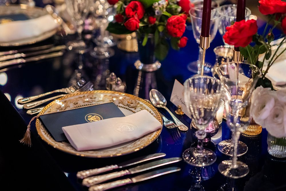 Table settings for the State Dinner in honor of President Emmanuel Macron of France and Brigitte Macron are seen Thursday…