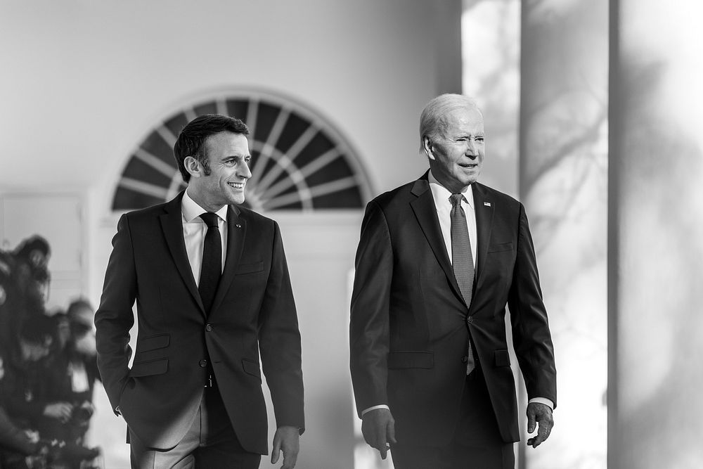 President Joe Biden walks with President of the French Republic Emmanuel Macron after participating in a receiving line with…