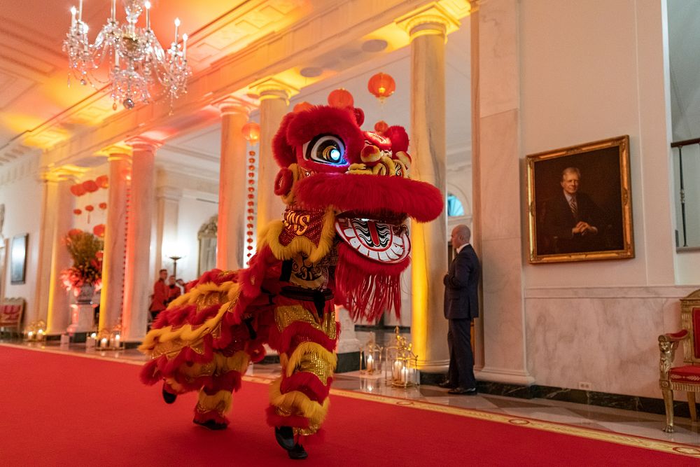 The Choy Wun Lion Dance Troupe makes their way through the Cross Hall to a Lunar New Year celebration in the East Room…