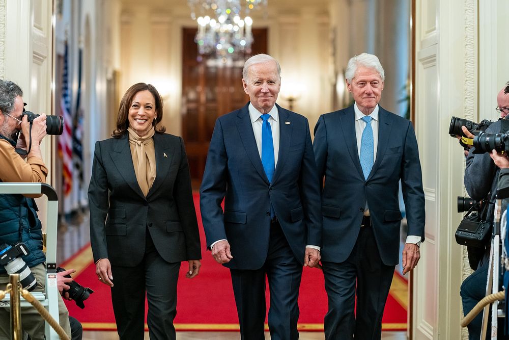 President Joe Biden, former President Bill Clinton and Vice President Kamala Harris arrive to the East Room for an event…