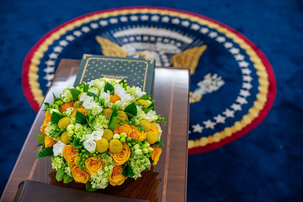 A flower arrangement sits on the coffee table in the Oval Office, Monday, January 30, 2023. (Official White House Photo by…