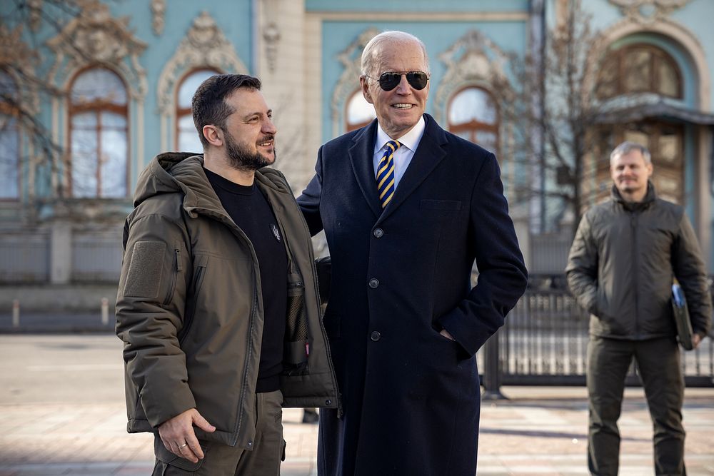President Joe Biden walks with Ukrainian President Volodymyr Zelenskyy, Monday, February 20, 2023, during an unannounced…