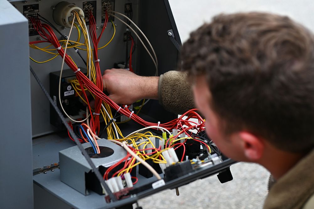 Aerospace Ground Equipment specialist performs a safety inspection.