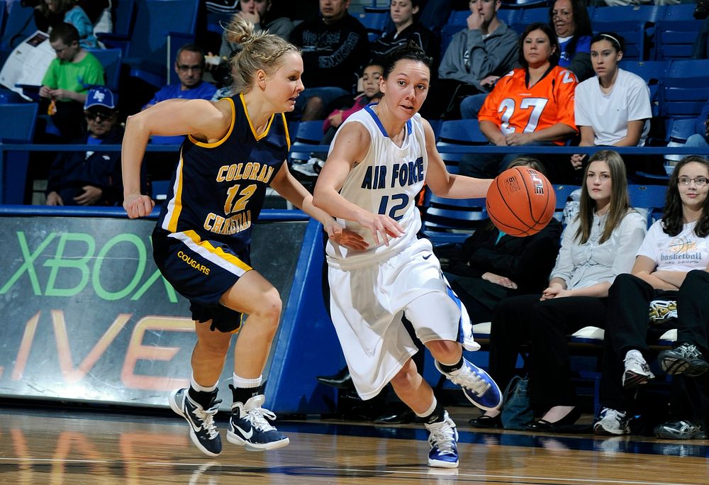 U.S. Air Force Academy (USAFA) Cadet Kelsey Berger, a guard on the women?s basketball team, drives to the basket during a…