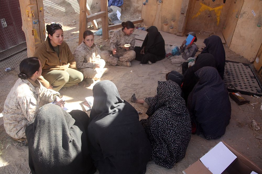 Afghan women attend a shura, or meeting, hosted by U.S. Marine Corps female engagement team members assigned 3rd Battalion…