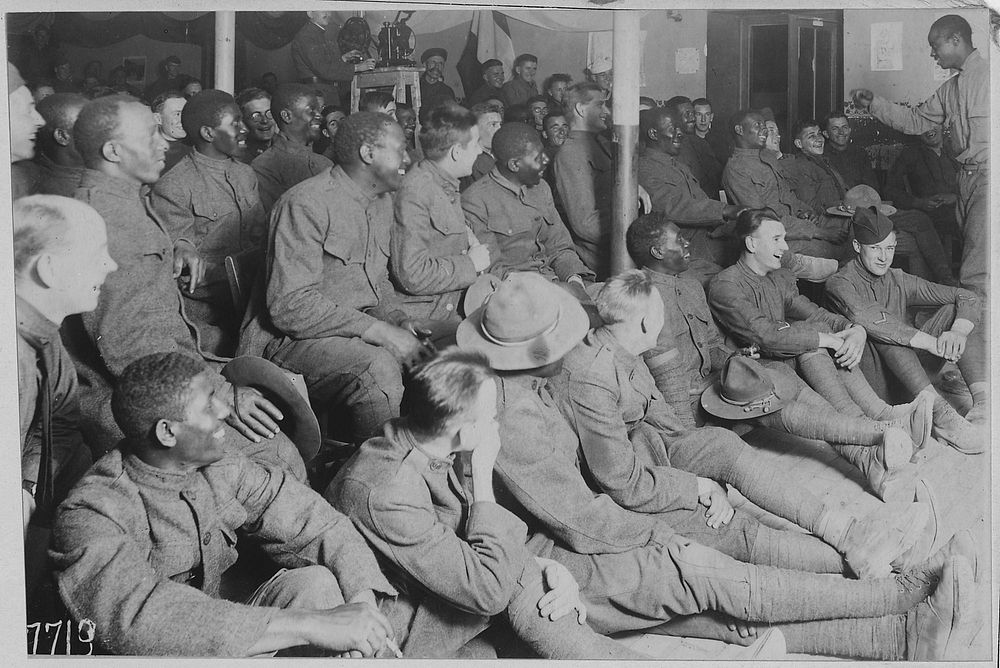 (African American) trooper entertaining his comrades in the American Red Cross Recreation Hut at Orleans, France. Original…