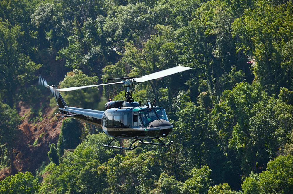 A Customs and Border Protection UH-1, Huey helicopter, patrols an area in the United States.