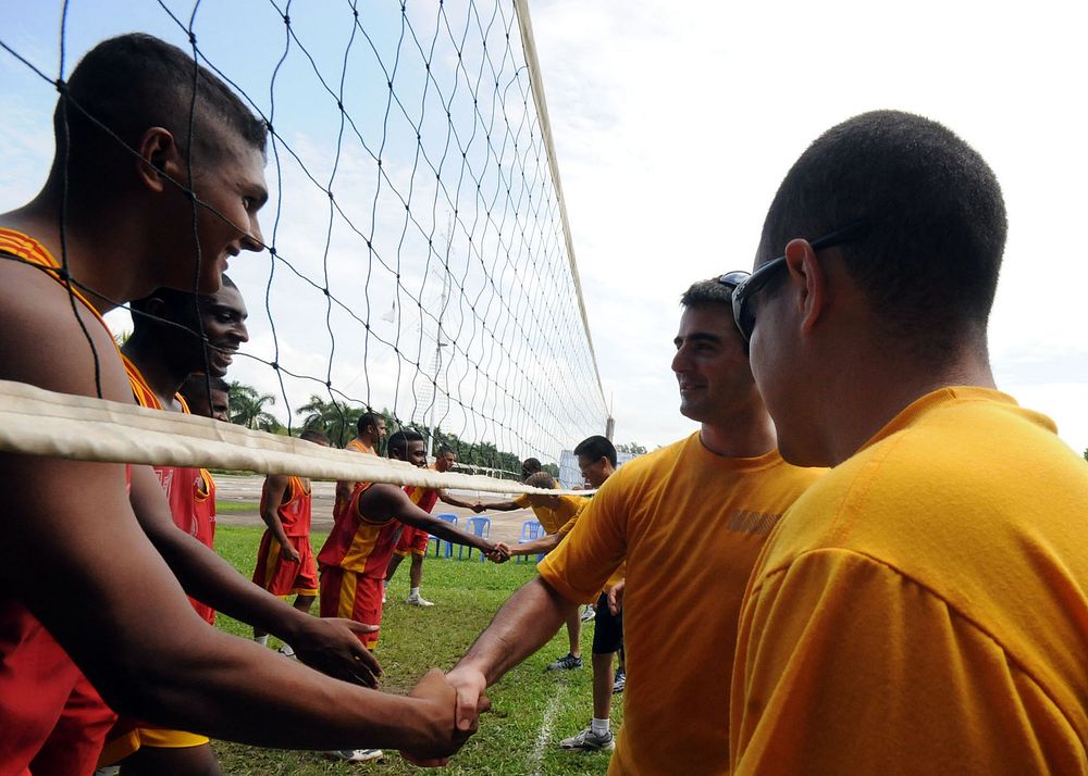 U.S. Sailors from the mine countermeasures ship USS Defender (MCM 2) congratulate Bangladesh navy sailors after a game of…