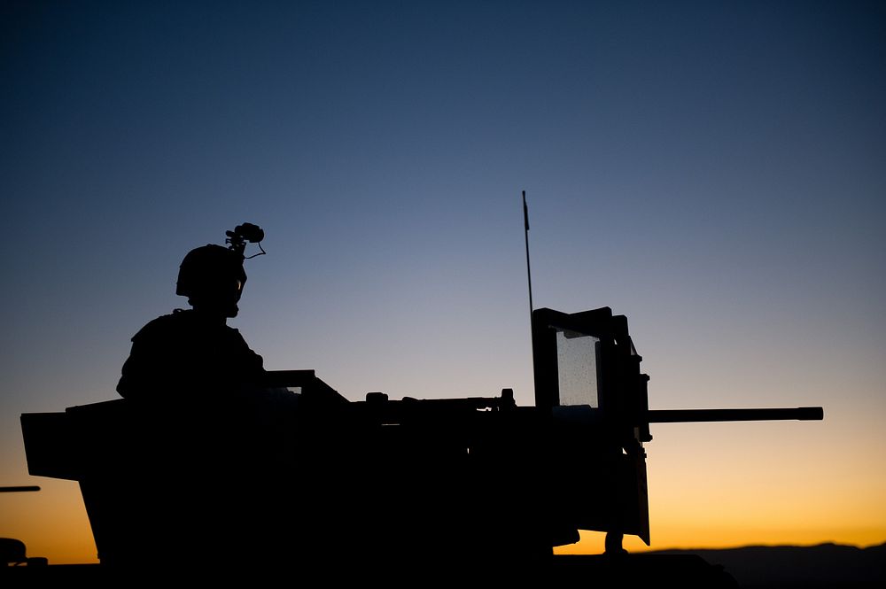 A U.S. Marine with Battalion Landing Team 3/1 keeps watch during a security halt before conducting a training raid at Camp…