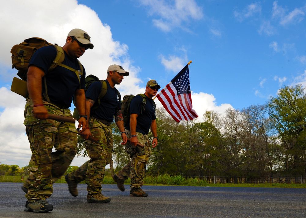 U.S. Airmen walk during the Tim Davis Memorial March in Flatonia, Texas, Oct. 17, 2011.