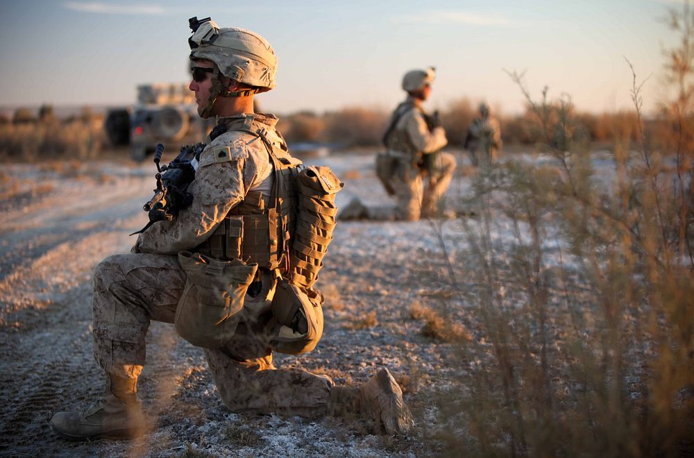 U.S. Marine Corps Sgt. Mitchell Lander, foreground, an enlisted adviser assigned to Border Advisory Team 1, provides…