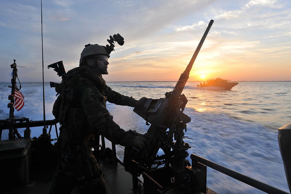 A U.S. Sailor assigned to Riverine Squadron (RIVRON) 2, mans a .50-caliber machine gun aboard a Riverine Command Boat off…