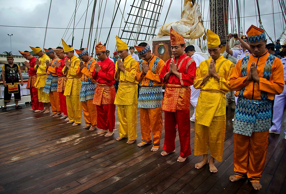 Indonesian sailors aboard Indonesian navy tall ship KRI Dewaruci perform a traditional dance following the ship's arrival at…
