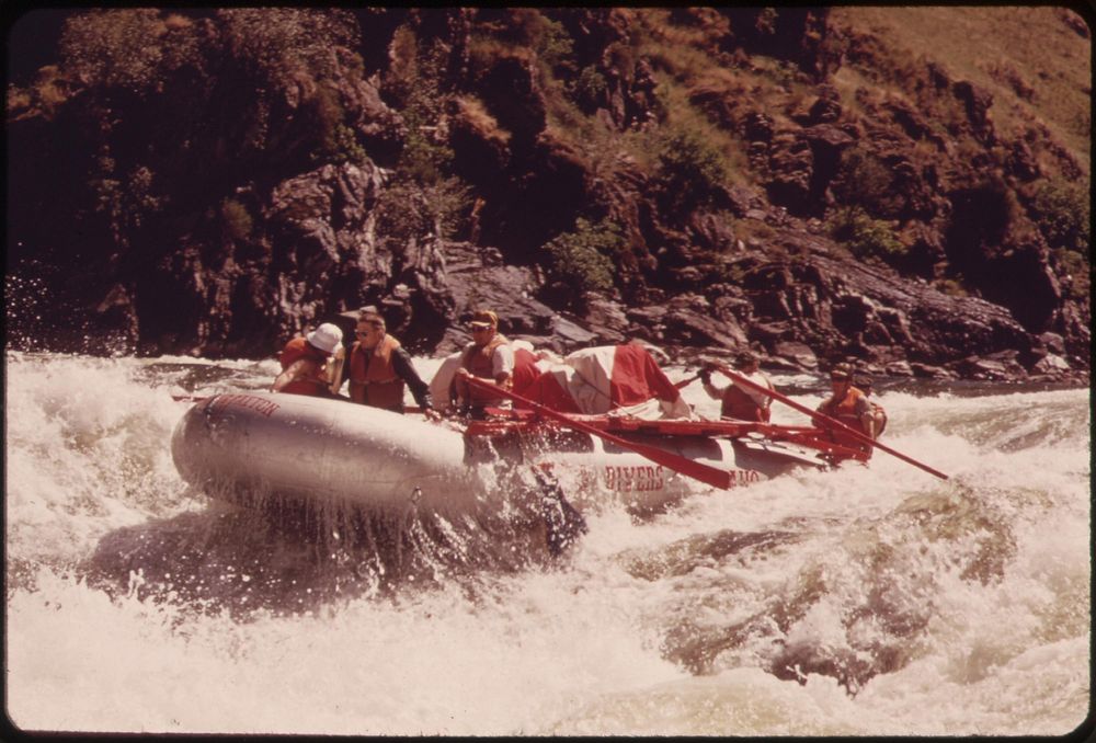 A large (28 foot) raft running Wild Sheep Rapids on the Snake River during a conservation trip through Hells Canyon…