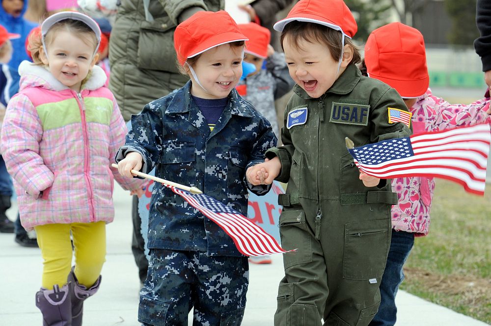 Children from the Yoiko Child Development Center (CDC) dress up in military attire for the "March with Pride" fun walk at…