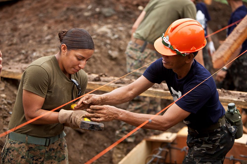 U.S. Marine Corps Lance Cpl. Melinda Carbajal, left, with Marine Wing Support Squadron (MWSS) 172, 1st Marine Aircraft Wing…