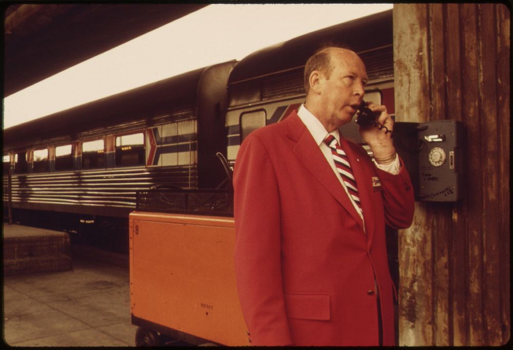 Amtrak employee checks with the station at the Los Angeles Union Passenger Terminal, May 1974. Photographer: O'Rear…