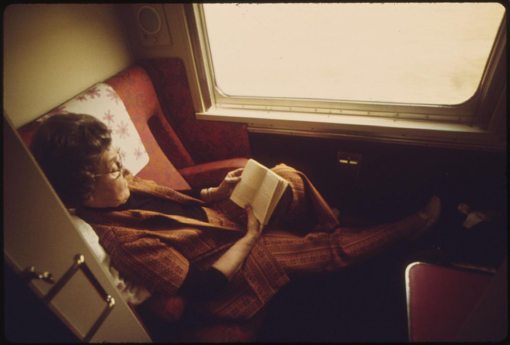 A passenger on the Lone Star passes the time reading in her compartment as the train crosses Oklahoma enroute from Chicago…