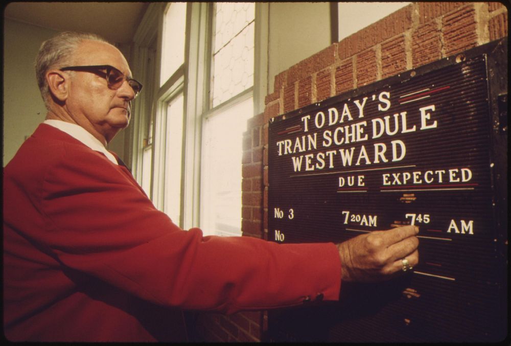 Amtrak station agent at Dodge City, Kansas, places the expected arrival time of the westbound Southwest Limited on a…