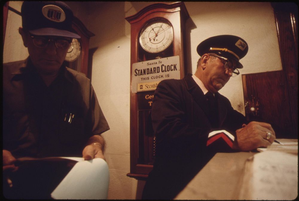 Train engineer, left, and conductor check in at the Dodge City, Kansas, station prior to boarding Amtrak's Southwest Limited…