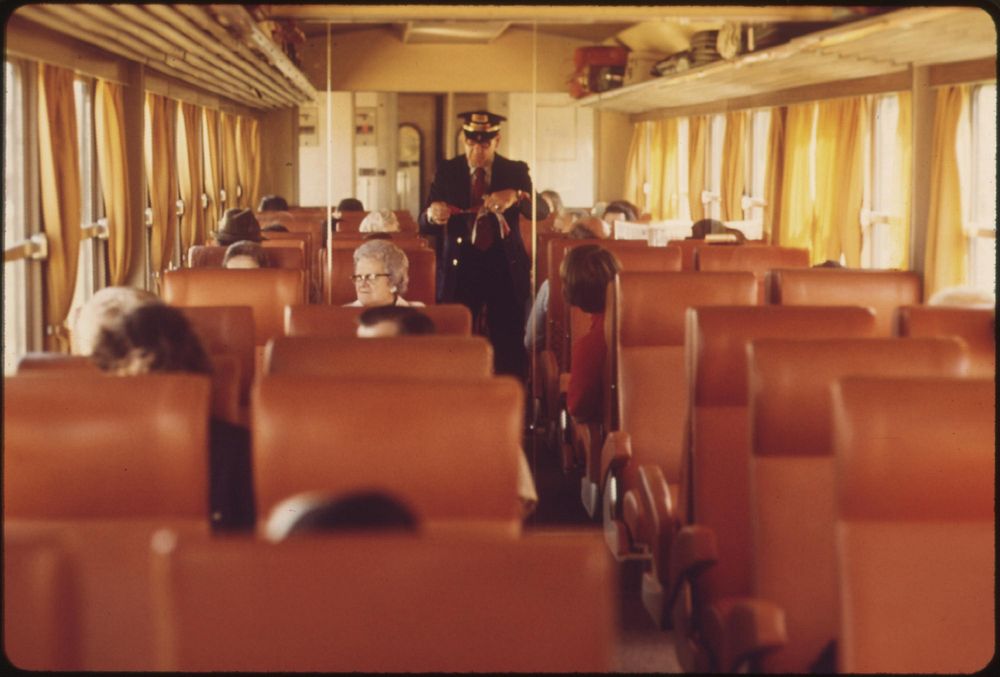 Conductor makes his rounds taking tickets as the turboliner makes its way between St. Louis, Missouri, and Chicago…