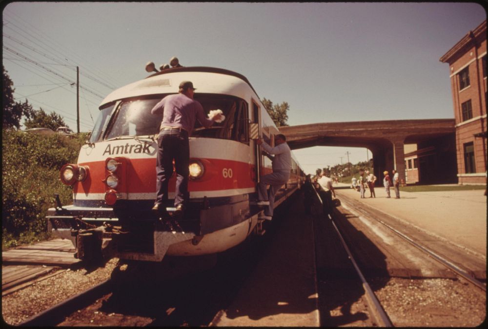 Turboliner engine's windshield is cleaned as the passenger train is stopped at Bloomington, Illinois, enroute from St. Louis…
