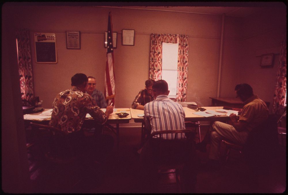 Monthly meeting of the Garland Village Board. Volunteer fire department is housed in the same building, May 1973.…