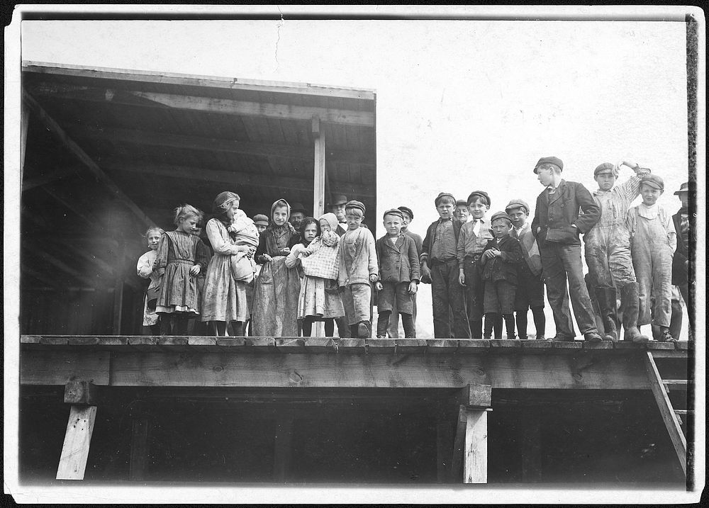 Oyster shuckers and baby tenders at Pass Packing Co. All worked from before daybreak until 5 P.M., February 1911.…