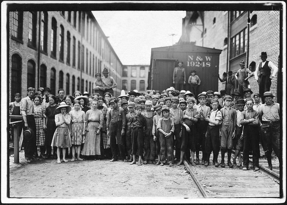 A part of the spinning force working in the Washington Cotton Mills. Group posed by overseer. All work, May 1911.…