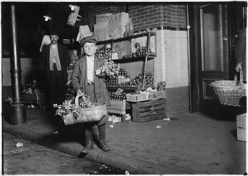 At center market. 11 year old celery vender. Has been in this country only half a year, April 1912. Photographer: Hine…