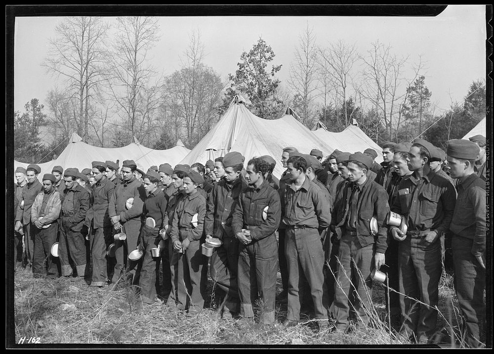 Newly-arrived replacements at CCC Camp, TVA #22, near Esco, Tennessee, lined up before their first meal in camp, November…
