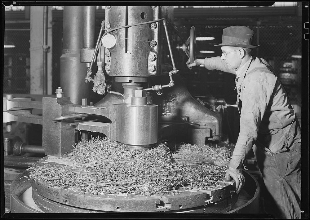 Railroad parts. Baldwin Locomotive Works. Machinist milling down part of a drive-shaft on big locomotive, March 1937.…