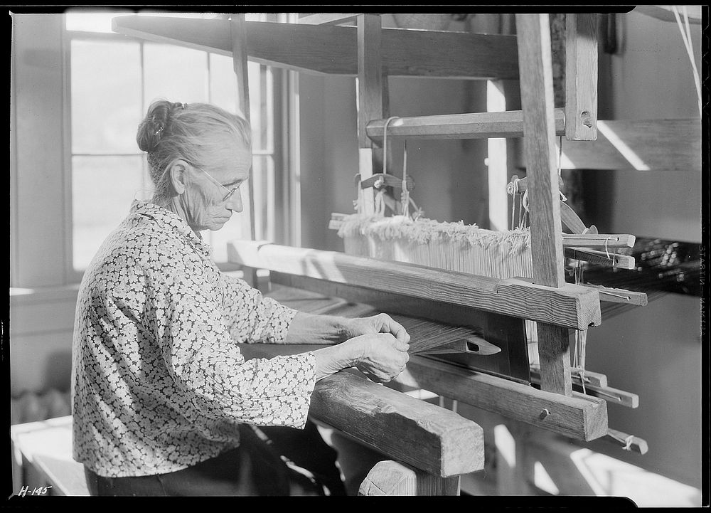 Aunt Lizzie Reagan, at the Pi Beta Phi School, Gatlinburg, Tennessee, weaving old-fashioned jean, November 1933.…