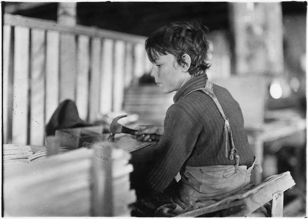 Boys making melon baskets. A basket factory. Evansville, Ind, October 1908. Photographer: Hine, Lewis. Original public…