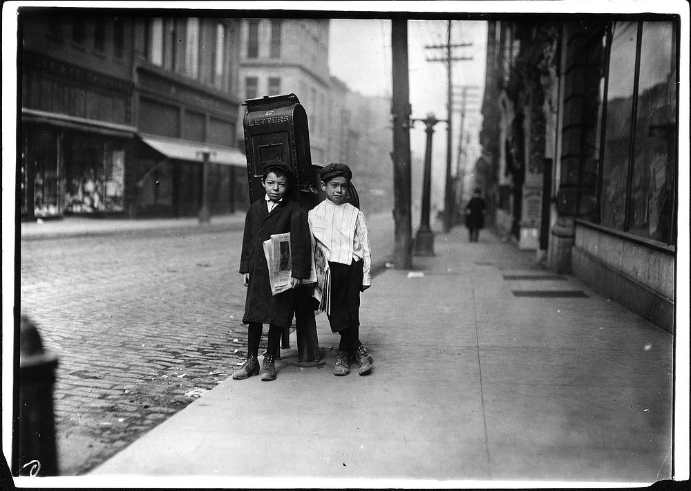 Two 7 year old newsies, profane and smart, selling Sunday. Nashville, Tenn, November 1910. Photographer: Hine, Lewis.…