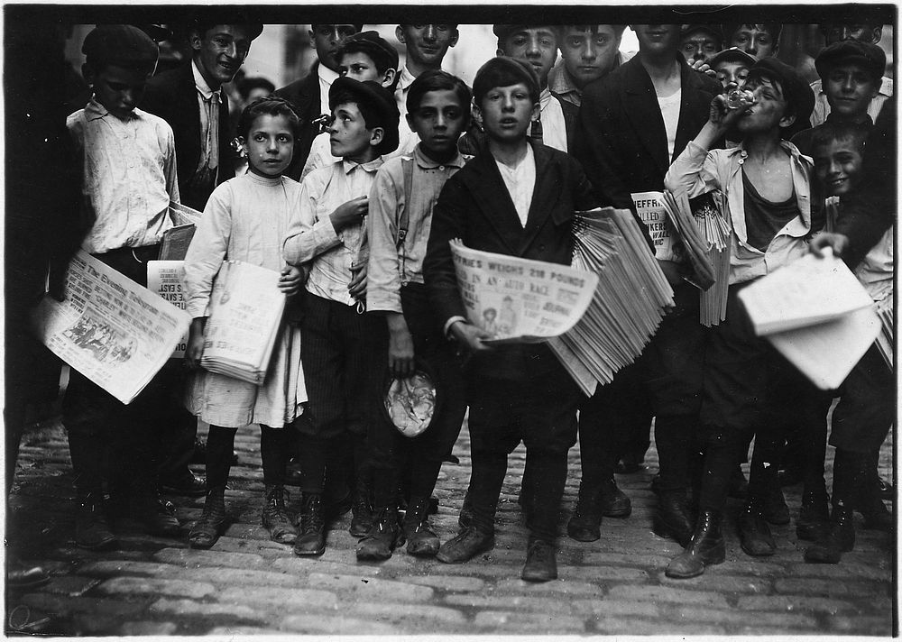 Newsboys and newsgirl. Getting afternoon papers. New York City, July 1910. Photographer: Hine, Lewis. Original public domain…