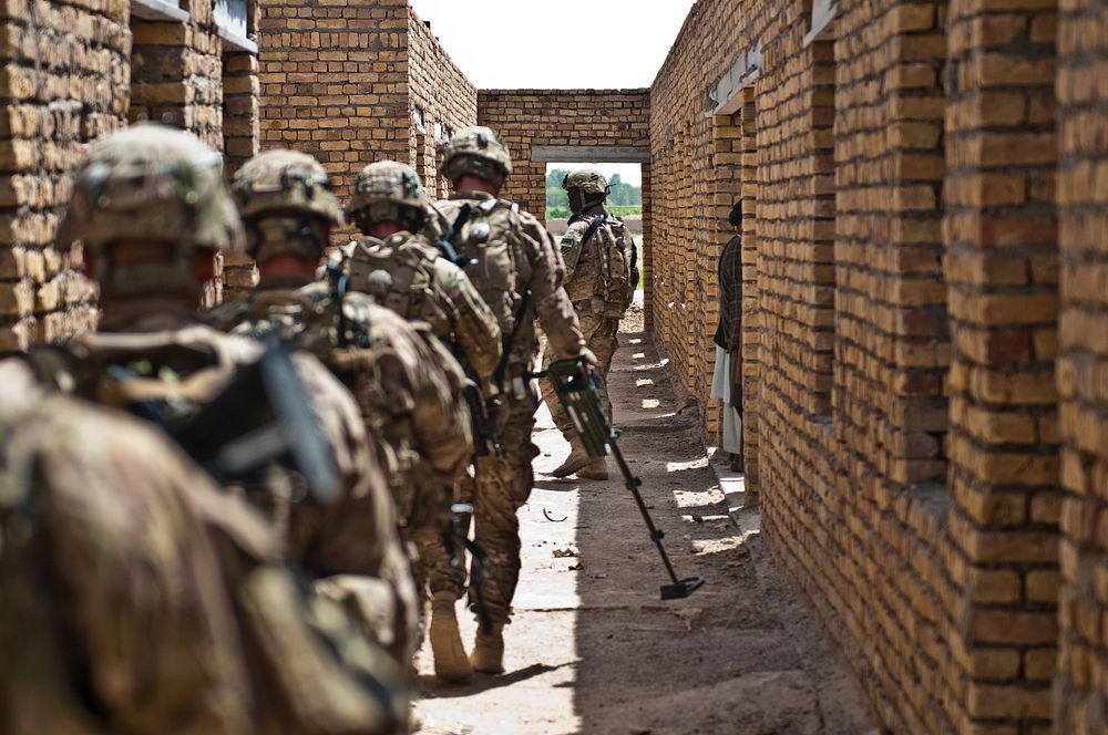 U.S. Soldiers with Combined Task Force Arrowhead use mine detectors to clear a school in Sperwan, Kandahar province…